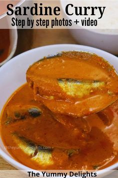 the recipe for sardine curry is shown in a white bowl on a wooden table