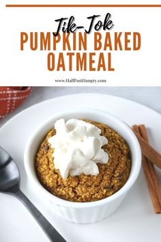 pumpkin baked oatmeal with whipped cream in a white bowl on a plate