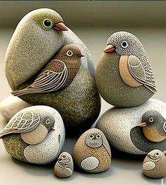 some little birds are sitting on some rocks