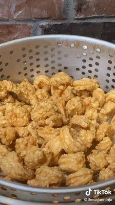 fried shrimp in a colander with the words fried shrimp on it's side