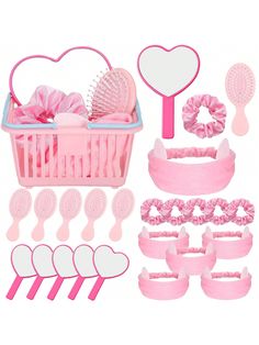 a set of pink hair accessories including combs, brushes and heart shaped shapes on a white background