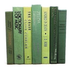 a row of green books sitting on top of each other