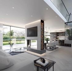 a modern living room with white furniture and large glass doors leading to an outdoor patio