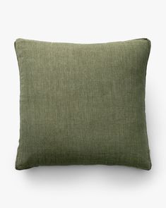 a green pillow on a white background