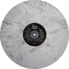 a white marble disk with black lettering on it