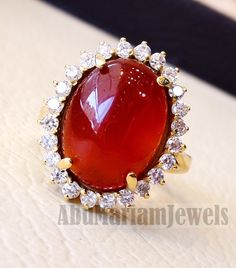 Cluster 18K Gold carnelian red aqeeq agate ladies ring red cabochon oval stone all sizes jewelry classic style white cubic zircon around Risk free Quality guarantee policy : If you are not satisfied with your item for any reason simply send it to us and you will get a replacement or refund . please write or choose your size with the order and we will size it for you . Our ring is handcrafted mostly with a few simple tools . but some methods are used in casting like lost wax method . 18 k gold st Aqeeq Ring Designs Women, Aqeeq Ring, Jewelry Classic, Gold Ring Designs, Carnelian Stone, Ladies Ring, 18k Gold Ring, Red Band, Name Jewelry