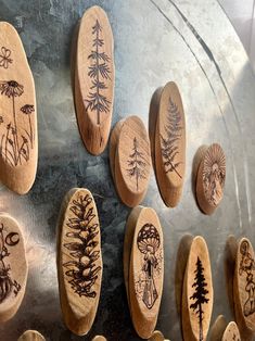 some wooden spoons with designs on them