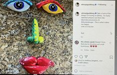 three plastic eyes and two fake hearts on a counter top next to a computer screen