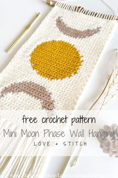 the free crochet pattern for this mini moon phase wall hanging is easy to make