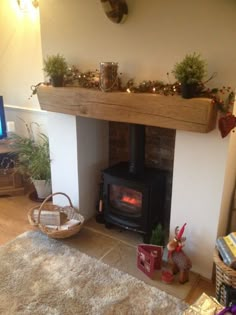 a living room filled with furniture and a fire place in the middle of it's fireplace