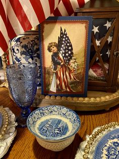 blue and white plates with an american flag in the background