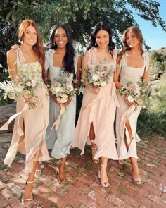 the bridesmaids are all wearing different dresses