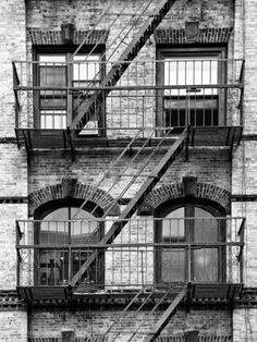 an old brick building with fire escape stairs