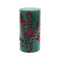 a green candle with red leaves on it