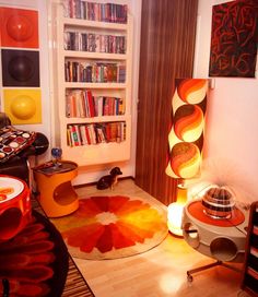 a living room filled with furniture and bookshelves