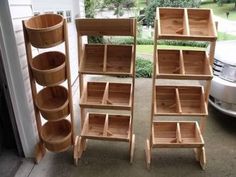 three wooden shelves sitting next to each other in front of a garage door with a car parked behind them