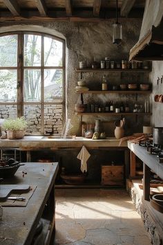 an old fashioned kitchen with lots of pots and pans