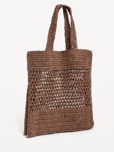 a brown crocheted bag on a white background with the handles down and one side open