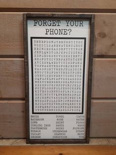 a sign on the side of a building that says, forget your phone's