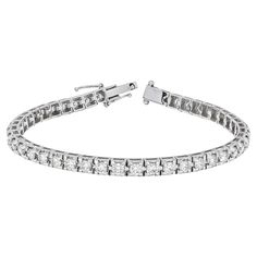 Elevate your style with this exquisite 18K White Gold Four Prong Tennis Bracelet. Crafted with meticulous attention to detail, it features a continuous line of dazzling round-cut natural diamonds, totaling 4.00 carats. Each diamond is expertly hand-set in a secure four-prong setting, allowing for maximum brilliance and light reflection. The white tones of the 18K white gold complement the diamonds beautifully, creating a radiant and luxurious piece that is sure to captivate. This tennis bracelet is designed to be a showstopper, commanding attention with its brilliant display of 4.00 carats of natural diamonds. The meticulously crafted links ensure a comfortable fit, while the secure four-prong settings offer both protection and an enhanced showcase of the diamonds' beauty. Whether worn as Bracelet Tennis, Continuous Line, Tennis Bracelet, Elegant Gift, San Valentino, Diamond White, Diamond Shapes, Arm Band, Prong Setting