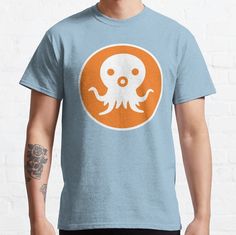 an orange and white octopus t - shirt on a man's blue tshirt