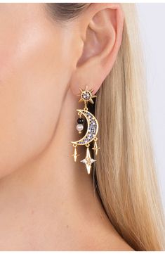 Colorful cubic zirconia stones add sparkle to statement making crescent moon earrings that will add celestial vibes to your look. 2" length Post back Brass/cubic zirconia Imported Celestial Earrings, Crescent Moon Earrings, Celestial Jewelry, Earrings In Gold, Cz Earrings, Moon Earrings, Blue Moon, Crescent Moon, Crescent