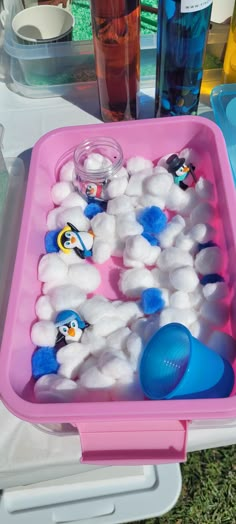 an ice tray filled with marshmallows and penguins