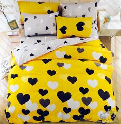 a bed with black and white hearts on it