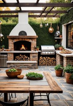 an outdoor kitchen with a pizza oven and grill