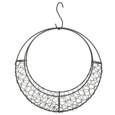 a circular metal object hanging from a hook