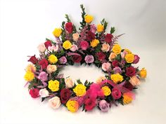 an arrangement of colorful flowers arranged in a circle