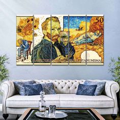 a living room with a couch and three paintings on the wall, one has a man's face