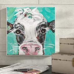 a painting of a cow on a wall