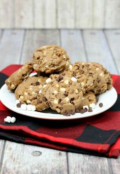 chocolate chip cookies with marshmallows on a white plate