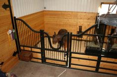 an animal is standing in its pen at the zoo or petting place for it's youngster