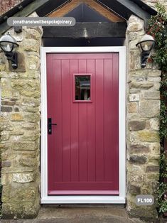 a red front door on a stone house