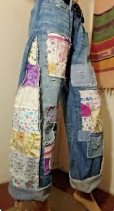 an old pair of jeans with patchwork on them