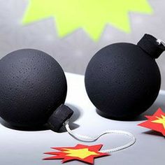 two black balls with red and yellow stars on them