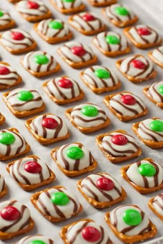 there are many decorated cookies on the tray