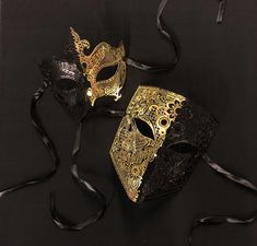 Black and gold Masquerade couples mask set are made of a lightweight laser cut metal that has a unique pattern. Masks are hand painted in two tone half gold and half black.   Masks are durable and have a comfortable fit. Silk ribbon ties attached. These masks are great for any Masquerade style event. Black And Gold Masquerade Mask, Masquerade Couple, Masquerade Mask Black, Couples Masquerade Masks, Luxury Mask, Mens Masquerade Mask, Masquerade Ball Mask