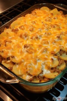 a casserole dish with meat and cheese in it sitting on the oven rack