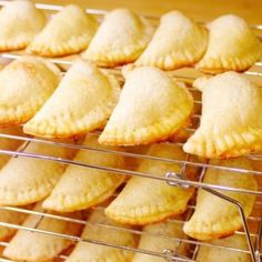 several pastries are cooling on a rack in the oven, ready to be eaten