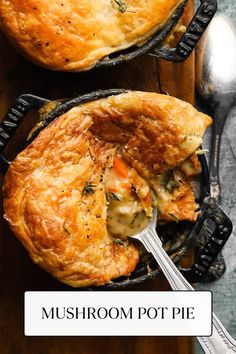 two pot pies sitting on top of a wooden table