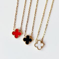 Introducing our exquisite Lucky Clover Necklaces, where elegance meets whimsy in a timeless design. Crafted with precision and passion, these necklaces feature delicate vibrant colored clover pendants adorned with gold chains, adding a modern twist to a classic symbol of luck and fortune. Each necklace is meticulously crafted from high-quality materials, ensuring durability and lasting beauty. The clover pendant hangs gracefully from a dainty chain, creating a subtle yet captivating statement piece that effortlessly enhances any ensemble. Available in an array of stunning colors, our Clover Necklaces cater to every style and preference. Whether you're dressing up for a special occasion or adding a touch of charm to your everyday look, these necklaces are the perfect accessory to complement Elegant Red Clavicle Chain Jewelry, Elegant Red Necklace With Clavicle Chain, Elegant Red Clavicle Chain Necklace, Elegant Red Jewelry With Gold Chain, Elegant Red Pendant Necklace, Elegant Red Jewelry With Delicate Chain, Luxury Red Flower Shaped Jewelry, Luxury Red Flower-shaped Jewelry, Elegant Red Flower-shaped Jewelry