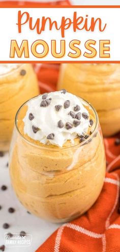 pumpkin mousse with whipped cream and chocolate chips on top in a glass bowl