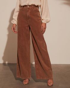 Introducing the Sophia Wide Leg Pants—where romance meets effortless chic. Made from luxe corduroy, these pants drape beautifully with their wide-leg silhouette, offering a blend of sophistication and comfort. The classic 5-pocket styling adds a practical touch while maintaining a polished look. Pair with a delicate blouse for a refined day look or dress up with a statement top for evening allure. Runs large, consider sizing down Corduroy fabric 5-pocket styling Zip fly with button closure 75% C Wide Corduroy Pants Outfit, Brown Wide Leg Pants Outfit, Wide Leg Pant Outfit, Wide Leg Pants Outfit, Nyc Street Style, Fall Pants, Velvet Clothes, Formal Pants, Corduroy Fabric