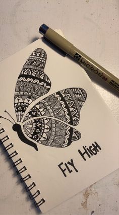 a drawing of a butterfly with the words fly high on it and a marker next to it