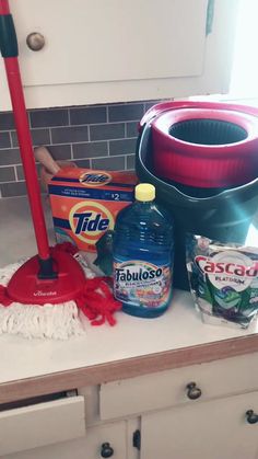 the kitchen counter is clean and ready to be used by someone with a mop