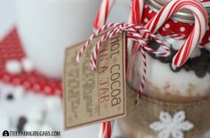 two jars filled with cookies and candy canes