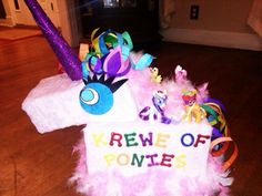 there is a sign on the floor that says krewe of ponies with feathers